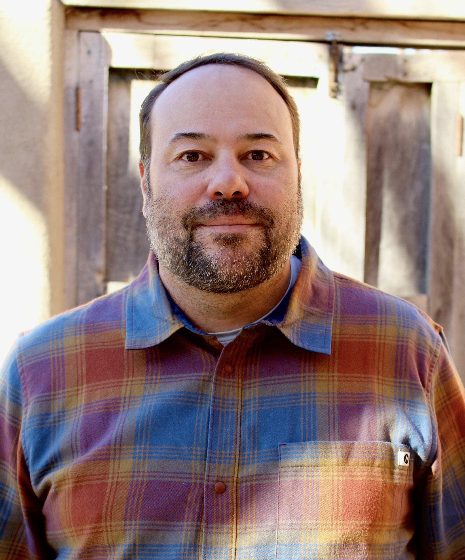 Perry Muller, Co-Owner of Tent Rock Inc, second-generation custom home builder in Santa Fe, NM, guiding clients through every build phase