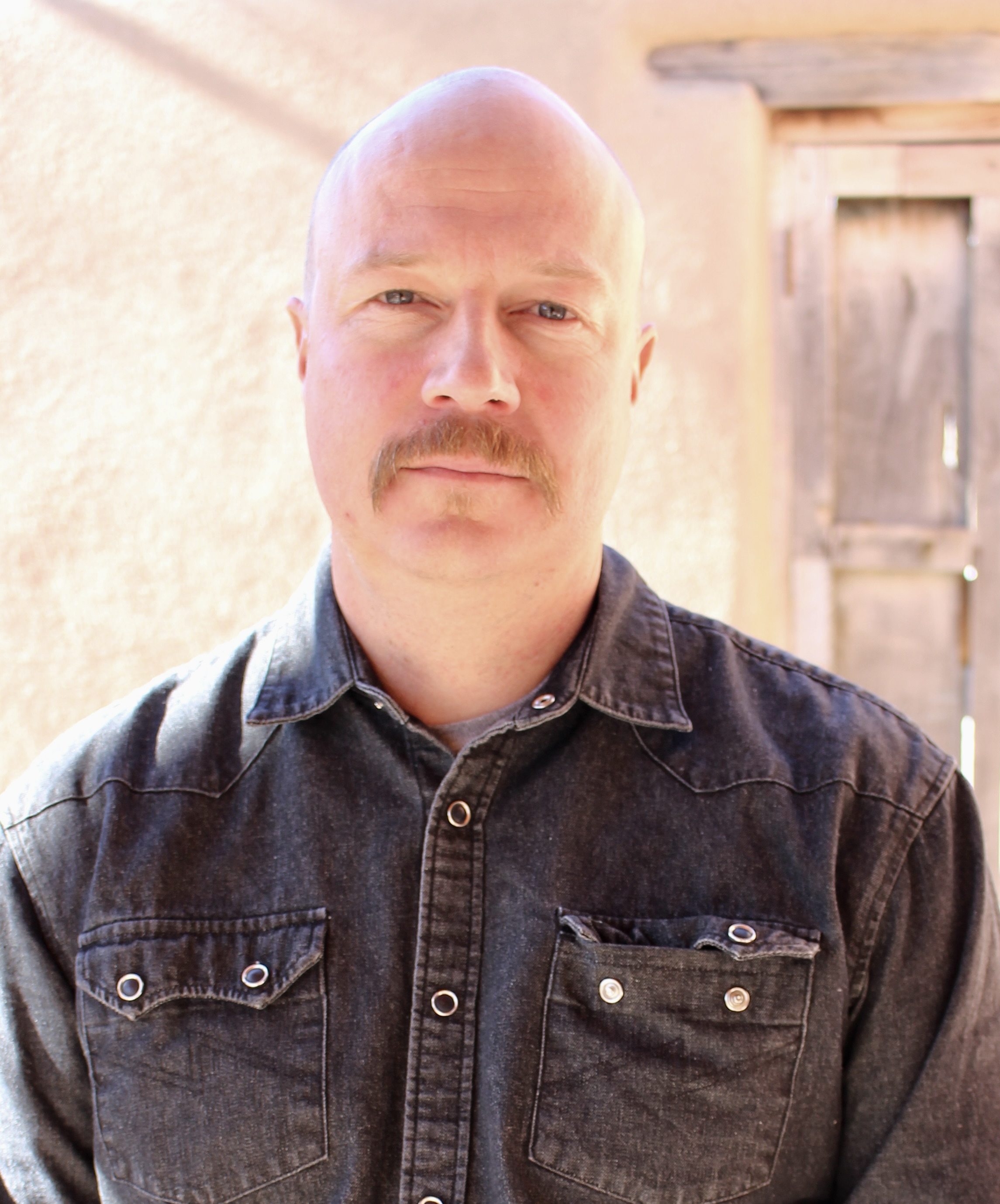 Riley Muller, Co-Owner of Tent Rock Inc, second-generation custom home builder in Santa Fe, NM, focused on design and project leadership